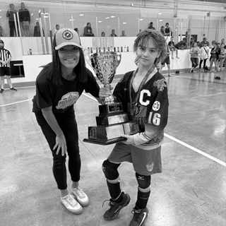 Player being presented with provincial trophy.