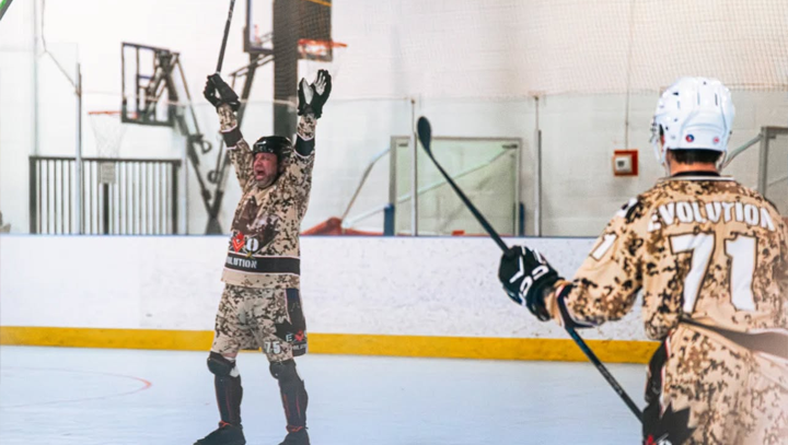 Goalie & teammates watching their game from the bench during a provincials tournament.